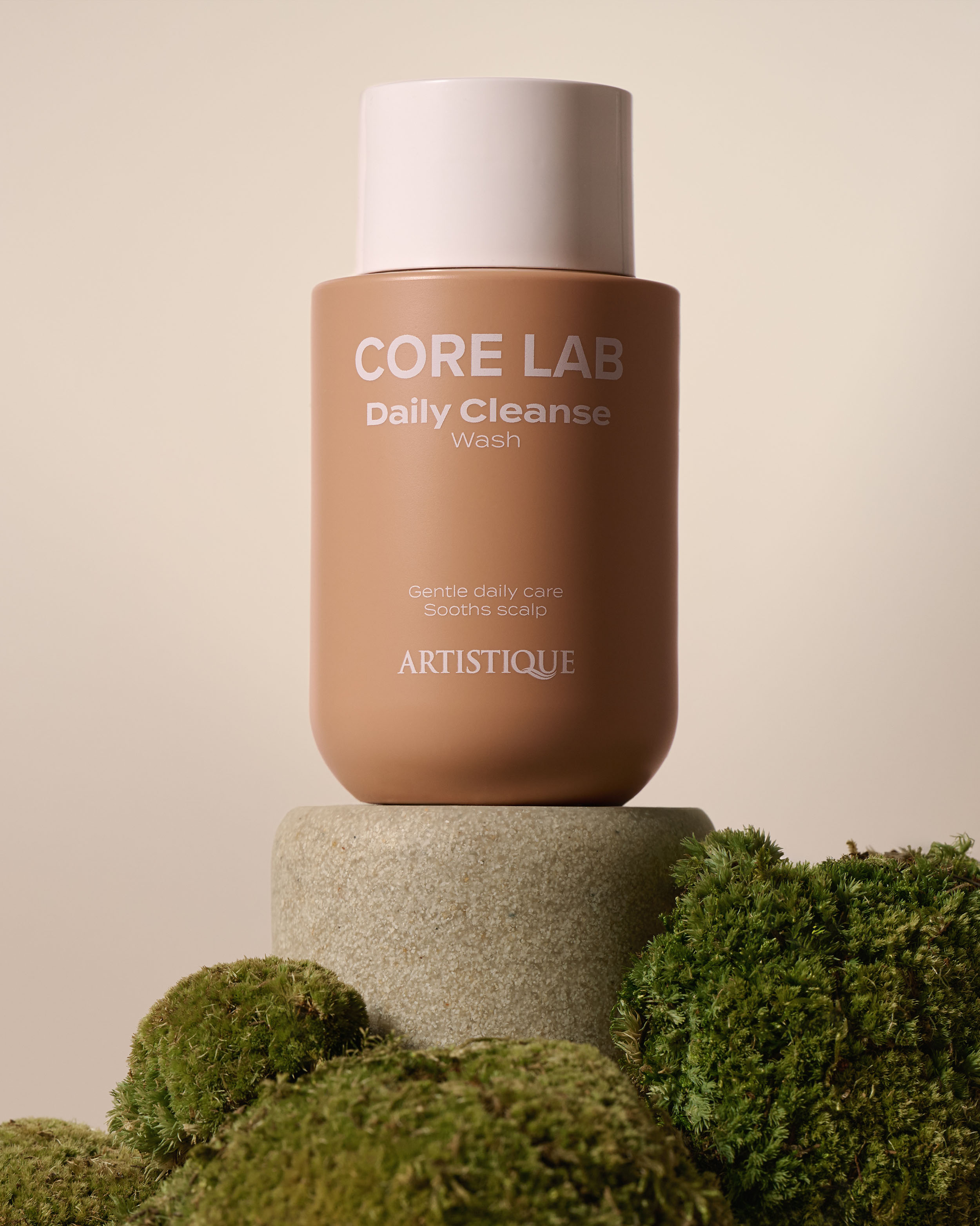 Product photography for Artistique - haircare product with professional styling and elegant presentation